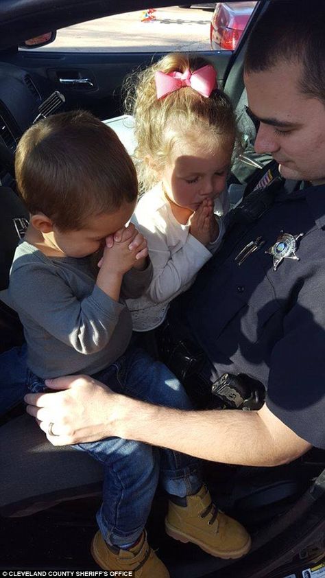 Precious moments: The image echoes another that was posted back in March of Cleveland County police officer Jordan Perkins praying with his children before starting a shift Police Lives Matter, Children Praying, Police Life, Police Wife, Say A Prayer, Blue Lives, Policeman, Second Child, Faith In Humanity