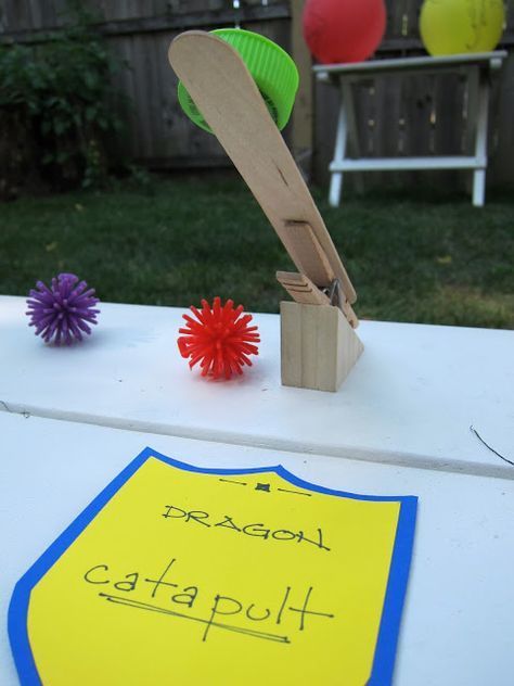 Medieval Book fair-Dragon catapult game with clothespins and foam balls Knight Birthday Party, Castle Party, Medieval Games, Knight Party, Dragon Birthday Parties, Medieval Party, Animation Ideas, Medieval Books, Dragon Birthday