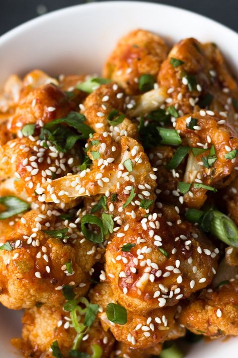 Crispy Chili Cauliflower - a flavorful dinner when served with rice, or the perfect spicy appetizer! | Fork in the Kitchen Sweet Spicy Chili, Chili Cauliflower, Baked Cauliflower Bites, Spicy Chili Sauce, Vegetarian Side Dish Recipes, Chili Fries, Crispy Cauliflower, Flavorful Dinner, Spicy Appetizers