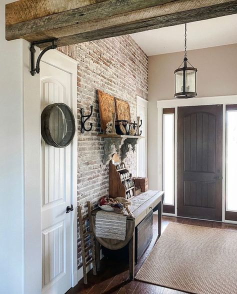 Brick Accents In Home, Brick Wall Entryway, Brick Entryway Wall, Cozy Country Living Room, Brick Entryway, Exposed Brick Accent Wall, Ceiling With Beams, Rustic Wood Beams, Exposed Wood Ceilings