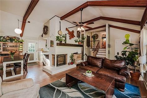 Split Level Bungalow, Living Room With Stove, Ceilings With Wood Beams, Split Level Living Room, Ceiling Beams Living Room, Beams Living Room, Owners Suite, Vaulted Ceiling Living Room, Living Room Retro