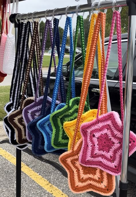 An iconic star-shaped bag that just pops! Perfect for holding your everyday necessities while still being super cute :) This bag features a sturdy strap to carry some weight, and a built in zipper to secure your belongings. Each star bag has a unique color combination! Crocheted Star, Crochet Hand Bags, Star Bag, Crocheted Bags, Bags Pattern, Gifts For Mother's Day, Mode Crochet, Crochet Shop, Crochet Business