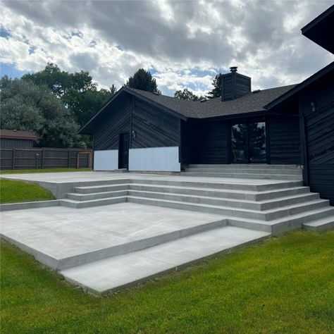 concrete-patio Raised Concrete Patio Ideas With Steps, Concrete Patio Sloped Yard, Concrete Patio Steps From House, Wide Patio Steps, Concrete Patio With Steps Down From House, Elevated Concrete Patio, Poured Concrete Steps, Outdoor Steps Ideas Stairs Entrance, Concrete Patio Stairs