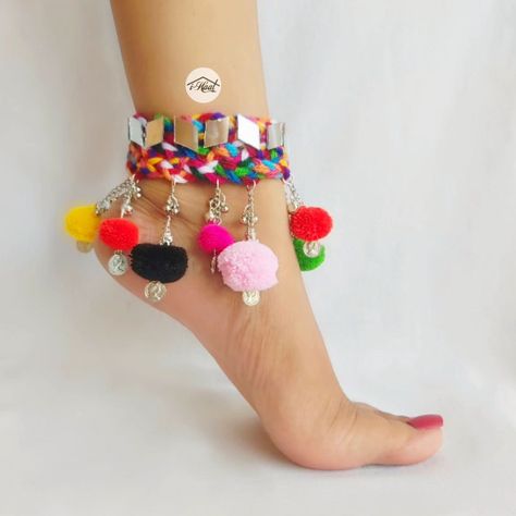 Are you shopping for your navratri look in advance? If yes, checkout these beautiful boho anklets Adorned with lots of mirrors, ghungroo and Multicolored pom poms🔥 These Multicolored boho anklets are perfect to match your garba vibes for this Navratri Season ❤️ Visit indiashaat.com for more handmade jewellery items #indiashaat #multicolorjewellery #bohojewelry #anklets #navratrijewellery #sajni [Handmade jewellery, navratri jewellery, Multicolored jewellery, unique jewellery, trendin... Unique Navratri Outfits Ideas, Garba Jwellery, Navratri Look, Canvas Shoes Diy, Navratri Jewellery, Navratri Collection, Kutch Work Designs, Diy Jewellery Designs, Diy Fabric Jewellery