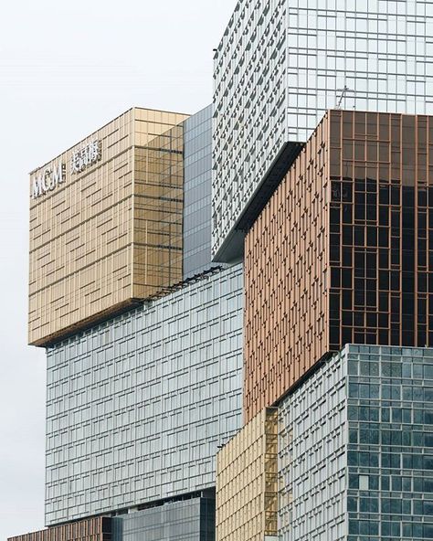 The initial plan for MGM COTAI was to build an architecturally compelling pair of towers inspired by the local culture. Beginning with the recognizable  three-tiered form of the MGM MACAU tower, the stacked boxes of each tower have been shuffled and  cantilevered to create a single modern sculptural form. Through the creative use of immaculate Chinese  decorative imagery for the façade expression, the abstract composition effortlessly brings to life a grand and  vibrant representation of Chin... Stacked Architecture, Box Architecture, Macau China, Abstract Composition, Jet Engine, Hotel Interiors, Welcome Decor, Stacked Jewelry, The Vision