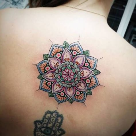 STAND TALL WITH A COLORFUL MANDALA TATTOO ON YOUR BACK #mandala #tattoo #mandalatattoo #tattoodesign #tattooinspo Follow us on Pinterest: www.pinterest.com/yourtango Colorful Mandala Tattoo, Mandala Tattoo Meaning, Tato Mandala, Dotwork Tattoo Mandala, Small Mandala Tattoo, Mandala Flower Tattoos, Wild Tattoo, Mandala Tattoo Design, Tattoo Designs And Meanings