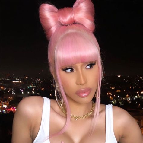 Cardi seems really into hair bows, as this is the second look with the style that she's worn during quarantine. The rapper shared a close-up of the bubblegum pink wig to Instagram on Tuesday, April 28. She used half the wig to create a bow on the top of her head while the rest of the hair (except for the bangs) was tied into a low ponytail. We're going to be watching closely to see if she experiments with any more bows while self-isolating. 4c Updo, Celebrities In Pink, Occasional Hairstyles, Celebs In Pink, Women Rappers, Cardi B Hairstyles, Pony Styles, Pink Hair Aesthetic, Brianna Dulce