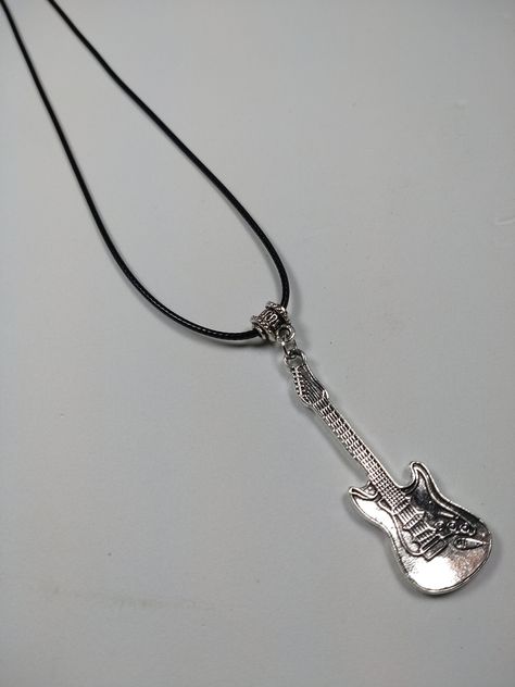 Black cord necklace with silver electric guitar charm. Great gift for a guitarist. Presented in an organza gift bag. Guitar Chip Necklace, Silver Electric Guitar, Guitar Bracelet, Guitar Necklace, Guitar Jewelry, Music Bracelet, Guitar String Jewelry, Guitar String Bracelet, Guitarist Gifts