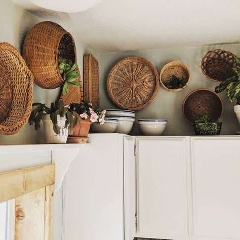 Baskets On Kitchen Cabinets, Basket Wall In Kitchen, Boho Decor On Top Of Kitchen Cabinets, Basket Display Above Kitchen Cabinets, Kitchen Decor Cabinets Tops, Wicker Baskets Above Kitchen Cabinets, Baskets Hung On Wall, Basket Above Kitchen Cabinets, Vintage Decor Above Kitchen Cabinets