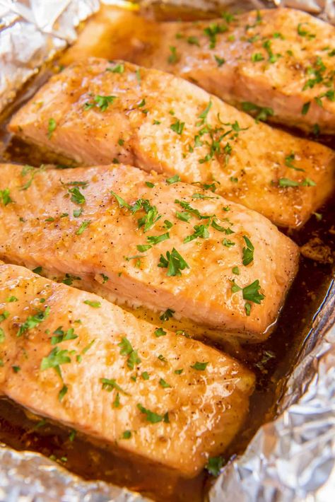 This oven Roasted Salmon is baked with a flavorful maple glaze until perfectly tender and flaky. With this method you can bake frozen salmon in under 30 minutes without thawing it in advance! Baked Frozen Salmon, Cool Salmon In Oven, Oven Roasted Salmon And Veggies, Cooking Frozen Salmon In Oven, Baking Frozen Salmon In Oven, Baking Salmon In Oven In Foil, Bake Frozen Salmon, Maple Salmon Recipes, Frozen Salmon Recipe