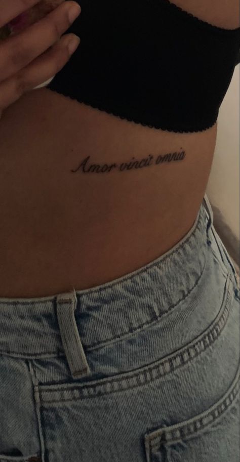 waist tattoo in latin amor vincit omnia Love Conquers All Tattoo, Basic Tattoos, Word Tattoo, Love Conquers All, Word Tattoos, Tattoo Inspo, All Tattoos, Tattoos And Piercings, Art Inspo