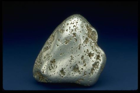 Close-up photograph of a platinum nugget (73736) from the National Mineral Collection Platinum Element, Natural Gold Nugget, Rock Identification, Chemistry Set, Silver Ingot, Gold Bullion Bars, Palladium Metal, Minerals Crystals Rocks, Geology Rocks