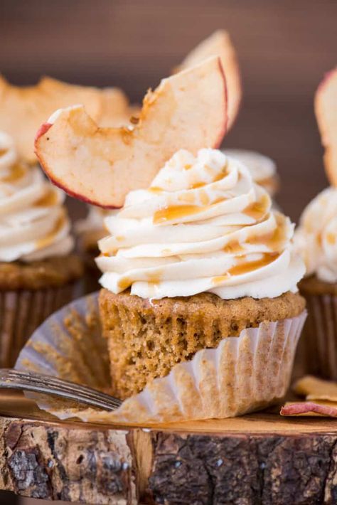 Apple spice cupcakes with salted caramel frosting are a great anytime cupcake, but especially in the fall! These fall applesauce cupcakes feel like a warm hug with applesauce in the batter along with cozy spices like cinnamon, cloves and allspice. #applespicecupcakes #spicecupcakes #fallcupcakes #applesaucecupcakes Applesauce Cupcakes, Dainty Cakes, Cider Caramel, Apple Spice Cupcakes, Apple Cider Caramel, Apple Breakfast Recipes, Cake Portions, Salted Caramel Frosting, Thanksgiving Cupcakes