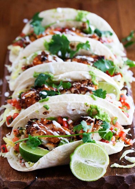 Cajun Fish Tacos - Delicious smoky seared Cajun fish with rich creamy avocado cilantro sauce & spicy tangy pico de gallo all wrapped in warm tortilla. Avocado Cilantro Sauce, Cajun Fish, Tortilla Recipes, Cilantro Sauce, Taco Party, Summer Cooking, Fish Tacos, Samosa, Quesadillas