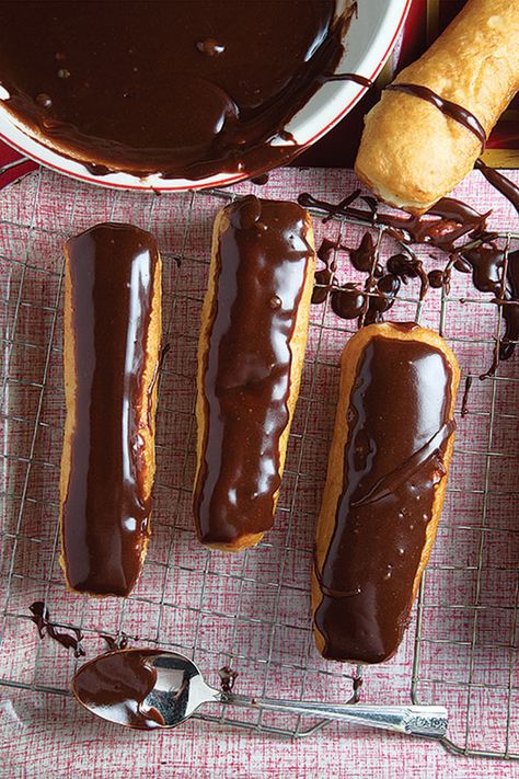 Eclair (Long Johns) Recipe | Saveur Chocolate Eclairs, Eclair Recipe, Doughnut Recipe, Chocolate Glaze, Long John, Long Johns, Cream Puffs, Donut Recipes, Eclairs