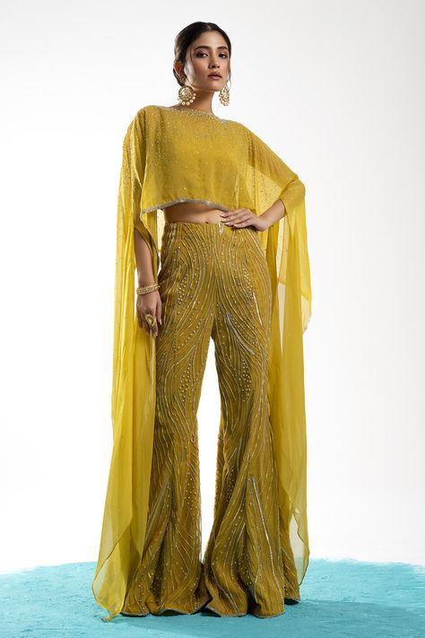 Shop for these amazing collections of Yellow Poncho: Organza Embroidery Cheeta Work Round Ernisa Pant Set For Women by Charu and Vasundhara online at Aza Fashions. Yellow Flare Pants Outfit, Embroidered Poncho, Mehendi Outfit, Haldi Outfits, Sangeet Outfit, Organza Embroidery, Trendy Outfits Indian, Diwali Outfits, Mehendi Outfits