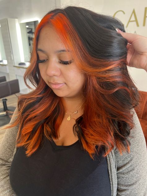 Orange And Black Hair Black Women, Black Hair With Auburn Money Piece, Orange Halo Hair, Bright Orange Highlights In Brown Hair, Black Hair With Orange Money Piece, Halo Colored Hair, Orange Underneath Hair, Orange Roots Black Hair, Orange Highlights In Black Hair