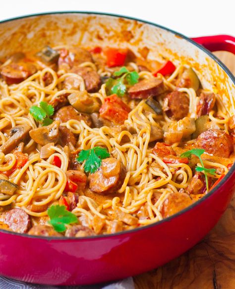 Looking for a simple recipe that packs a lot of flavor? My creamy sausage pasta skillet is super easy to make and incredibly delicious!  I make this sausage pasta with loads of smoky sausage; I used Polish kielbasa but feel free to use any smoky variety. Then, add tons of veggies like zucchini, mushrooms and […] Creamy Tomato Pasta Sauce, Sausage Pasta Skillet, Sausage And Spaghetti Squash, Sausage Pasta Sauce, Sausage Pasta Recipe, Creamy Sausage Pasta, Pasta Recipes Video, Creamy Tomato Pasta, Pasta Skillet