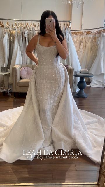 Kinsley James Couture Bridal on Instagram: "Obsessed is an understatement when it comes to this dress ✨ - - - - - - #weddinggown #bridetobe #losangeles #bridalboutique @theknot #bridaltrunkshow #herecomesthebride #soloverly #theknot #weddingchicks #theknotweddings #aisleperfect #wedding #sayyestothedress #bridalinspo #weddinginspiration #shesaidyes #bride #stylemepretty #californiabride #chicbride#californiawedding #romanticwedding #dressoftheday #bridegoals #walnutcreek #leahdagloria" Added Skirt Wedding Dress, Plus Size Convertible Wedding Dress, Wedding Dress Attachable Skirt, Wedding Dress Removable Skirt Two Pieces, Attachable Skirt Wedding Dress, Loose Mermaid Wedding Dress, Wedding Dress With Skirt Attachment, Wedding Dresses With Overskirt, Overlay Skirt Wedding Dress