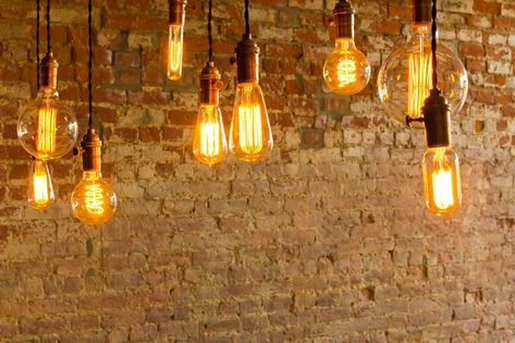 Antique light bulbs are a huge trend in interior design, but how can you use them in your own home? Read on as we break down a few easy ways to add instant vintage charm to any room. Vintage Charms, Light Bulbs, Light Bulb, This Is Us, Interior Design, Canning, Design