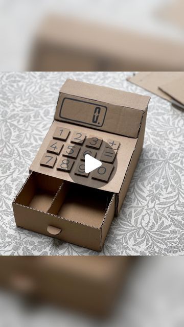 Cheryl Gavrielides on Instagram: "Cardboard cash register 💰   This has definitely been my longest lasting cardboard creation!!  And we use it regularly!!   If my children need something to enhance their play I will look for the cheapest way to get that resource/toy. And you can’t get cheaper than making it yourself! 😂  With a few bits of thick cardboard and a glue gun I believe you can make almost anything!!!   Right I’m looking for a challenge. I’ve already been asked to make a few things on the other app. (TT) So let me know what I should try and make next!!  #craftsforkids #cardboardcreations #cardboardcrafts #diyprojects #recycledart #cardboardbox #diy #fantasyhasreallynolimits #recycleandplay #diytoy #diytoysforkids #playroom #imaginativeplay #imaginaryplay #learnthroughplay #playid Cute Thing To Make Out Of Cardboard, Diy Cardboard Cash Register, Card Board Box Diy, What To Do With A Cardboard Box Diy, How To Make A Cash Register Diy, Cardboard Kids Crafts, Crafts Made Out Of Cardboard, Easy Things To Make Out Of Cardboard, Cute Things To Make Out Of Cardboard