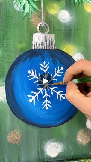 Christmas Ornament Painting Tutorial | Many of you are probably decorating your Christmas tree today so let's paint a fun snowflake ornament to celebrate! 🎨🎄
 #easypainting #tutorials... | By Emily Seilhamer Art | I bet many of you are
decorating your Christmas tree today so let's paint an
ornament to celebrate. I'm going to start with another
simple up and down background using dark green and light
green to start. I want it to look like the background is
like a Christmas tree but faded. Even mix in a couple
little pieces of dark green. You can do whatever colors you
want. I'm even going to take a little bit of dark navy blue
and white and put that in there as well to make it feel cold.
Maybe it's an outdoor Christmas tree. Remember, you can do
whatever color combination you want though. Acrylic Painting Christmas Easy, Easy Painting Ideas On Canvas For Beginners Christmas, Diy Canvas Art Easy Simple, Ornament Painting Ideas Easy, Christmas Paintings On Canvas Easy Diy, Christmas Canvas Art Easy, Christmas Ornament Painting, Nutcracker Painting, Ornament Painting