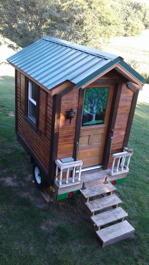 This is Mike’s DIY Hand-Built Micro House in Iowa. He spent $300 on the trailer and used cheap and recycled products to (almost) finish the build. Please enjoy, read more and re-share below! … Micro House On Trailer, Micro Cabin Diy, Tiny Tiny House, Apitherapy House, Small House Trailer, Home Made Camper Trailer, Micro Camper Trailers, Micro Camper Diy, Cabin Trailer