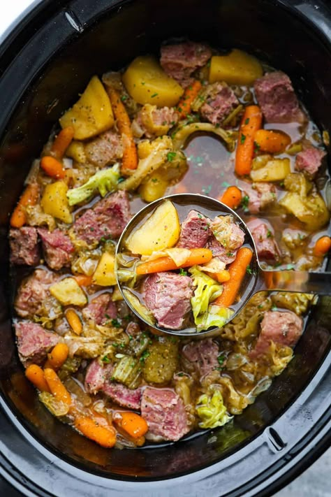 Corned Beef and Cabbage slow cook all day with hearty vegetables making one delicious stew! This is a classic recipe with nostalgic flavors, and it's so easy to whip up. Corned Beef And Cabbage Stew, Corned Beef Stew, Corned Beef Soup, Cabbage Slow Cooker, Stew Slow Cooker, Cabbage Stew, Slow Cooker Corned Beef, Corn Beef, Corned Beef And Cabbage