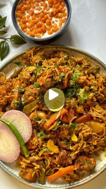 निधि राठौड़ on Instagram: "Made this Instant One Pot Veg Biryani😋 for lunch using @pigeonkitchenappliances . Served it along with my favourite boondi raita and the combination is absolutely worth trying 🤩
The recipe turned out to be easy and hassle free as Pigeon Electra Electric pressure cooker has 
- 18 pre set menu in which you can cook variety of dishes.
- no monitoring needed
- auto shutoff and 
- the food taste remains exactly the same as normal pressures cooker.

Do SAVE the video and don’t forget to try this veg biryani recipe :))

#Pigeon #PigeonKitchenAppliances #LifeBanayeEasy 

#vegbiryani #vegbiryanirecipe #biryani #food #foodlover #indianfood #ricerecipes #humbiharsehain #foodie #biryanilove #biryanilovers #biryanirecipe #biryanilover #veg" Veg Biryani Recipe, Biryani Food, Boondi Raita, Veg Biryani, Biryani Recipe, Electric Pressure Cooker, Biryani, Rice Recipes, Pressure Cooker