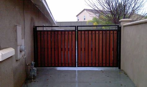 Metal and wood side gate.  12  foot double door gate.  2" square tube welded frames.  1" square uprights.  Handmade Mexican clavos for looks.  Composite wood.  Won't rust and won't warp.  Heavy duty zirk greasable hinges. Square Tube Gate Design, Double Door Gate, Wood Gates, Fence Door, Side Gate, Barn Shop, Fence Doors, Gate Ideas, Side Gates