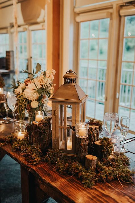 Greenery Filled Wedding #rustic #shabbychic #weddingdecor Rustic Lodge Wedding Decor, Winter Wedding Welcome Table, Winter Wedding Reception Decor, Rustic Winter Party, Wedding Decor Lanterns, Lantern Wedding Centerpieces, Winter Wedding Table, Winter Wedding Centerpieces, Lantern Centerpiece Wedding