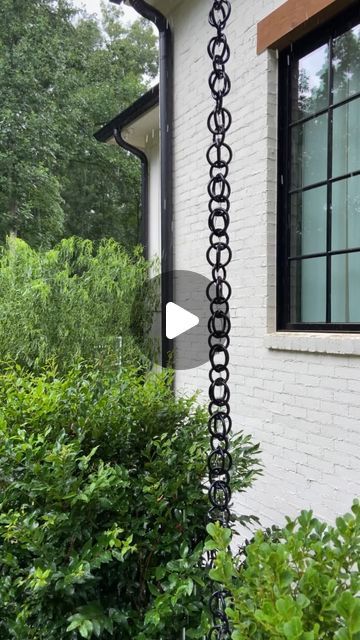 Kelly Jones on Instagram: "We’ve been putting some finishing touches on the flip house. One was installing a rain chain on the front porch just like the one we have on ours. Link in bio for full tutorial." Chain Gutter Downspout, Chain Rain Gutters, Rain Catcher Chain, Tiny Front Porch Decor, Rain Chains Gutter Downspout Ideas, Rain Chain Basin Ideas, Rainchain Ideas, Modern Rain Chains, Rain Chain Ideas