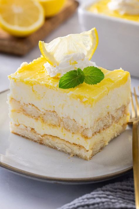 This Lemon Tiramisu is a citrusy, creamy, and delicious take on a classic Italian dessert. If you love classic tiramisu, you are going to love this recipe. Lemon Teramasoo, Lemon Tirimasu Recipes, Lemon Christmas Dessert, Lemon Tiramisu With Lemon Curd, Lemon Curd Recipe Desserts, Lemon Curd Pudding, Lemon Mascarpone Cake, Lemon Curd Dessert, Lemon Mousse Cake