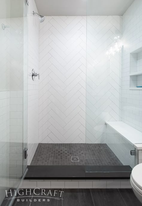 And 4×16 white subway tiles create a herringbone accent wall in the shower. Herringbone Accent Wall, Makeover Kamar Mandi, Subway Tile Showers, Subway Tiles Bathroom, Remodel Basement, Glass Shower Door, Wash Stand, White Subway Tiles, Master Shower