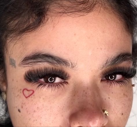 Small Heart Tattoo On Face, Heart Tattoo Under Eye, Small Heart Face Tattoo, Heart Under Eye Tattoo, Baddie Face Tattoos, Tiny Face Tattoos For Women, Small Face Tattoos For Women, Cute Face Tattoos, Heart Face Tattoo