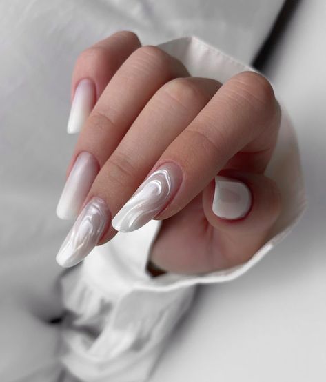 These long nails feature a milky white base with a dreamy marble effect. The swirling patterns add depth and uniqueness, making them a statement piece for modern nail art lovers. Long Milky White Nails, Milky White Nails, Nails 2025, Modern Nail Art, Milky Nails, Milky White, Marble Effect, Art Lovers, White Nails