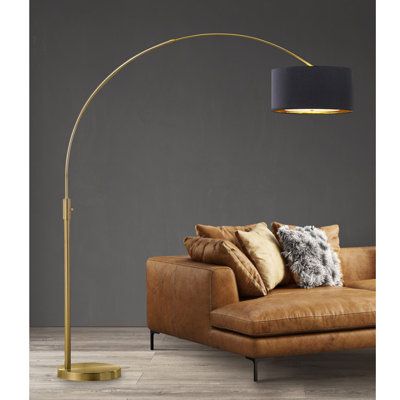 The arch floor lamp brings a simple, solid, and stylish illuminating statement, featuring an adjustable arc and easy-reach rotary dimmer switch with a free dimmable LED bulb that fits perfectly in open spaces, behind a sofa or personal couch Shade Color: Black/Gold | Mercer41 Eluterio 81" Brushed Brass Arched / Arc Metal in Yellow | 81 H x 68 D in | Wayfair Arched Floor Lamp Living Room, Overhang Lamp, Arc Floor Lamp Living Room, Arc Floor Lamps Living Room, Arc Lamps, Arch Floor Lamp, Living Room Floor Lamp, Floor Lamps Living Room Modern, Floor Lamp Living Room