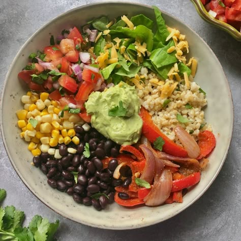 Rice Bowls Vegetarian, Vegetarian Burrito Bowl, Lime Brown Rice, Cilantro Lime Brown Rice, Vegetarian Burrito, Vegetarian Bowls, Fajita Vegetables, Creamy Avocado Sauce, Burrito Bowls Recipe