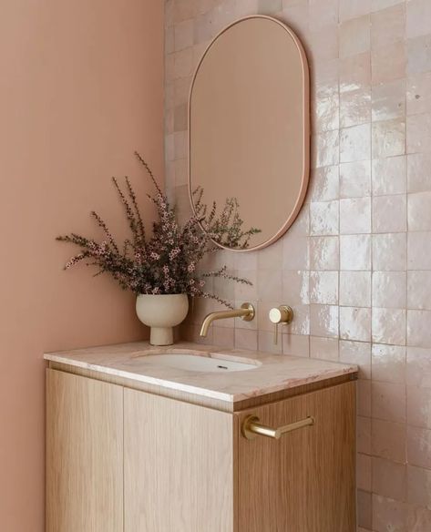 If you're on the hunt for some colorful, elegant, and timeless bathroom decor ideas--look no further. Read on to see great designs for your small bathroom. Small bathroom ideas| small bathroom decor | Small bathroom renovation | Peach Toilet, Peach Bathroom Ideas, Colorful Small Bathroom, Nude Bathroom, Coloured Bathroom, Square Toilet, Peach Bathroom, Abi Interiors, Color Of The Year 2024