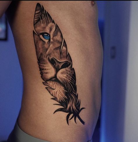 #ElegantTattoos #FineLineTattoo #ChicTattoos #ArtisticInk #SophisticatedTattoo #DelicateTattoo #MinimalistTattoo #ElegantInk #StylishTattoos #ElegantBodyArt Lion Face In Feather Tattoo, Lion In Feather Tattoo, Lion Feather Tattoo Design, Tiger Feather Tattoo, Lion With Feathers Tattoo, Feather Lion Tattoo, Lion Eyes Tattoo For Women, Lion Feather Tattoo, Wolf Feather Tattoo