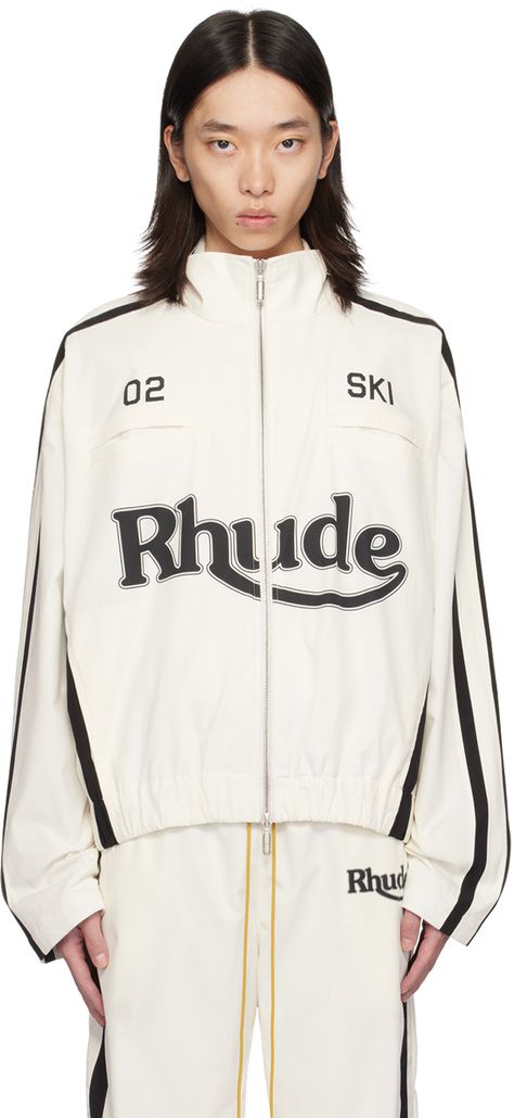 Polyester poplin jacket. · Funnel neck · Two-way zip closure · Text and logo printed at front · Welt and seam pockets · Elasticized hem · Stripes at side seams and sleeves · Full satin lining Supplier color: White/Black White Track Jacket With Reflective Details For Streetwear, Rhude Outfits Women, Track Jacket, Luxury Track Jacket With Embroidered Logo For Streetwear, Urban Winter Track Jacket With Graphic Print, White Sporty Outerwear With Logo Detail, Tracksuit Outfit Women, Rhude Sweatshirt, Track Suits Women