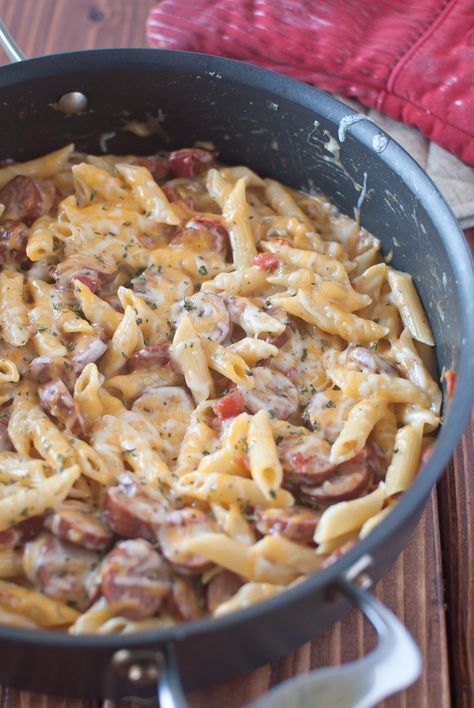 little bits: Sausage Pasta Skillet {recipe} I made this using leftover sausage links we grilled out and it was amazing! And so easy!! Sausage Pasta Skillet, Spicy Sausage Pasta, Pasta Skillet, Skillet Pasta, Spicy Sausage, Sausage Pasta, Skillet Meals, One Pan, Sausage Recipes