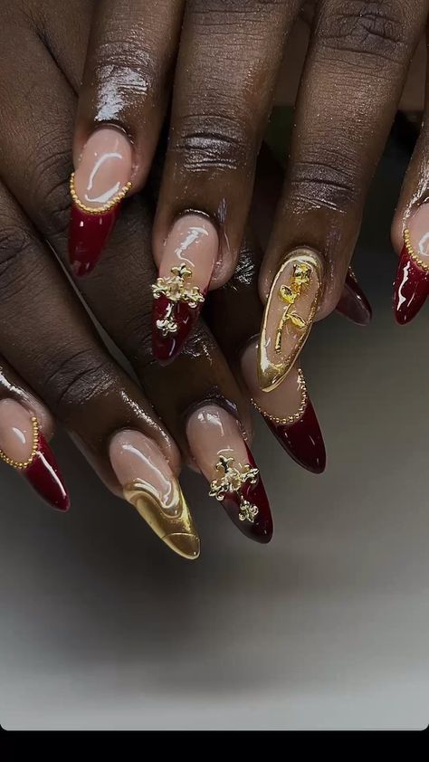 Red And Gold Nails Aesthetic, Nails Acrylic Burgundy And Gold, Red And Gold Nails Almond Shape, Iron Man Nails Acrylic, Jessica Rabbit Inspired Nails, Sweet 16 Red Nails, Breanna Quan Nails, Gold Red And White Nails, Christmas Nails Extreme