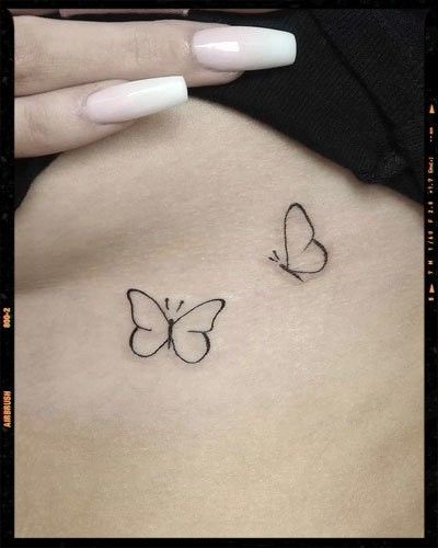 image Small Black Butterfly Tattoo Simple, Butterfly Wrist Tattoos For Women Simple, First Tattoo Ideas For Women Butterfly, Plain Butterfly Tattoo, Simple Butterfly Tattoo Design For Women, Small Outline Butterfly Tattoo, Butterfly Outline Tattoo Simple, Small White Butterfly Tattoo, Simply Butterfly Tattoo