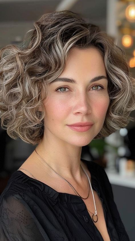 22 Short & Curly Hairstyles For Older Women to Enhance Your Grace Short Curly Bobs For Women Over 50, Chin Length Hair Curly Short Wavy Hairstyles, French Bob For Curly Hair, Curly French Bob, Curly Bobs For Older Women, Short Curly Hair 2024, Curly Bob Hairstyles 2024, Classic Wedding Hair, Bob Haircut Curly