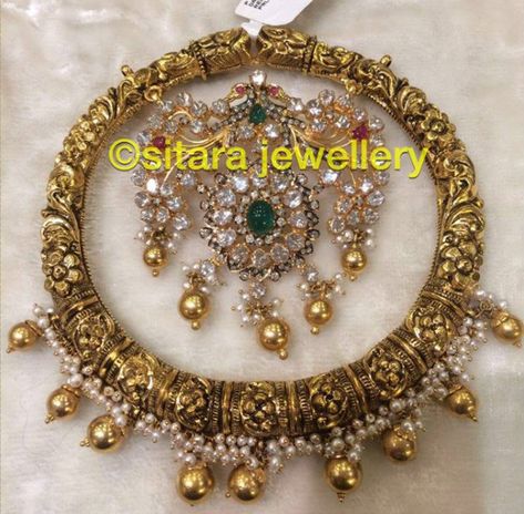 22 Carat gold antique finish heavy nakshi pendant studded with flat diamonds, rubies and emeralds by Sitara jewellery, Hyderabad. Bangle style pendant, heavy gold pendant designs, nakshi pendant Nakshi Pendant, Gold Pendant Designs, Gold Bangles Indian, Pendant Designs, Gold Bridal Necklace, Bridal Jewelery, Clean Gold Jewelry, Antique Gold Jewelry Indian, Pendant Sets