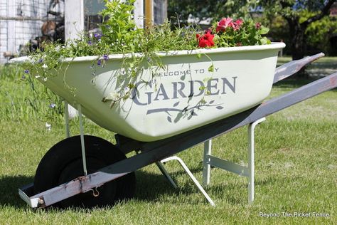 Old Wheelbarrow Planter, http://bec4-beyondthepicketfence.blogspot.com/2016/05/welcome-to-my-gardenstencil-paint.html Wheelbarrow Painting Ideas, Wheelbarrel Ideas, Painted Wheelbarrow Ideas, Old Wheelbarrow Ideas Planters, Old Wheelbarrow Ideas, Painted Wheelbarrow, Decorative Wheelbarrow, Wheel Barrel Planter, Wheelbarrow Decor