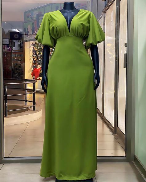 Taken 🫱🏽‍🫲🏾💚#madeinuganda 💚This vibrant green dress features a plunging V-neckline, puffed sleeves, and a flattering fit. The open back design with tie up straps adds a bold touch, while the flowing skirt creates an elegant silhouette…perfect for formal and casual occasions. #veevacouture Sleeve Design For Gown, Simple Gown Styles, Elegant Dresses Classy Modest, Ankara Corset Top, Corporate Outfits For Women, Ankara Corset, Casual Gown, Simple Dress Casual, Chic Dressing