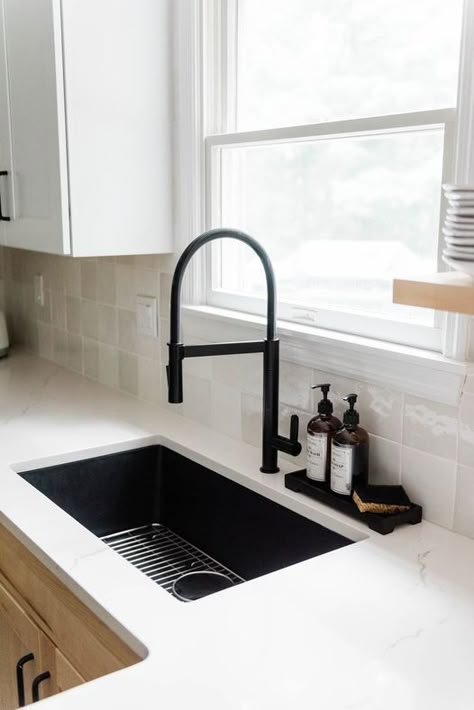 Add a bold statement in your kitchen with a black quartz sink and matte black faucet.

Photo/design: @giulianodesigns

#kitchenremodel #kitchendesign #homedecor #homedesign #homeremodel Black Farmhouse Sink With Gray Cabinets, Black Sink Kitchen White Counter, Black Tap Kitchen Sinks, Large Black Kitchen Sink, Matte Black Sink Faucet, Kitchen Ideas With Black Sink, Black Home Fixtures, Black Kitchen Faucet Gold Hardware, Black Matte Sink Kitchen