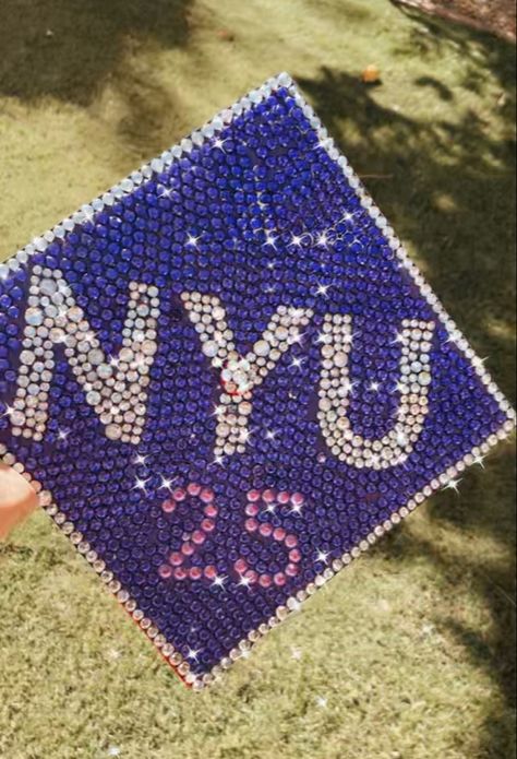 Bedazzled rhinestoned cap design Nyu Grad Cap, Bedazzled Grad Cap, Nyu University, Nyu Dorm, Ivy League Aesthetic, Grad Cap Design, College Wallpaper, Grad Cap Designs, Grad Caps